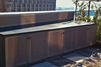 tapered copper countertop with patina and backsplash